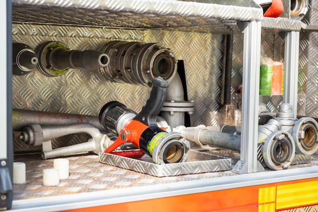 Different details of firefighting equipment ready to assemble in open truck metal body at contempora...