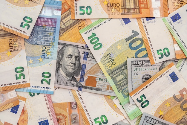 Different euro and dollar banknotes, finance background. investment