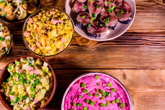 Different festive dishes on a wooden table Top view