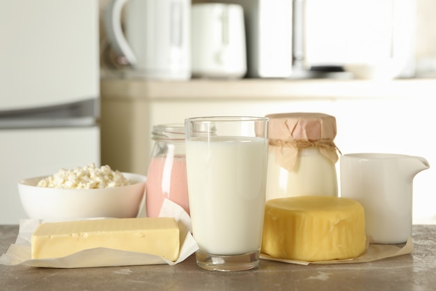 Different fresh dairy products on gray table