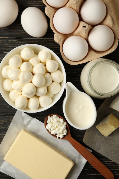 Different fresh dairy products on wooden background