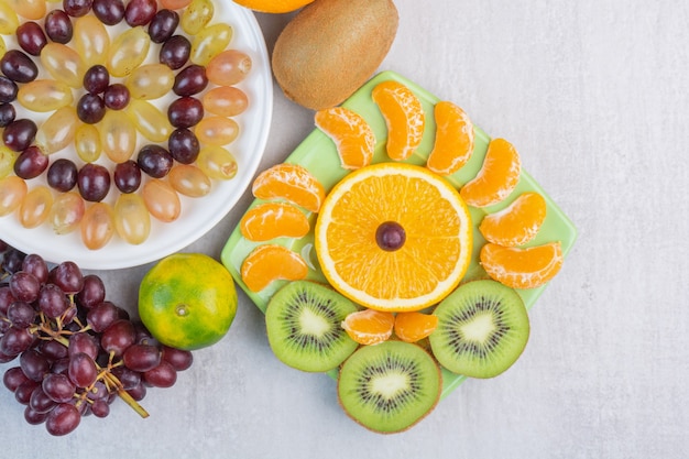 Different fruits on dish, on the mixed.