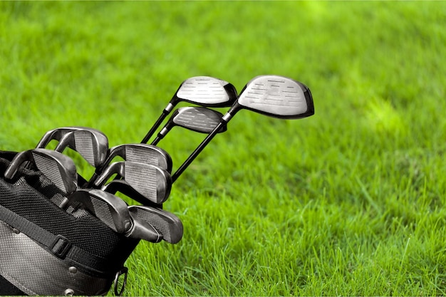 Different golf clubs on blurred background