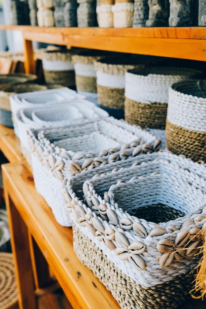 Different handmade weaving square baskets in craft shop