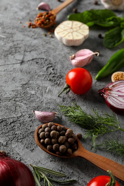 Different ingredients for cooking on gray textured background