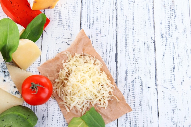 Different Italian cheese on wooden background