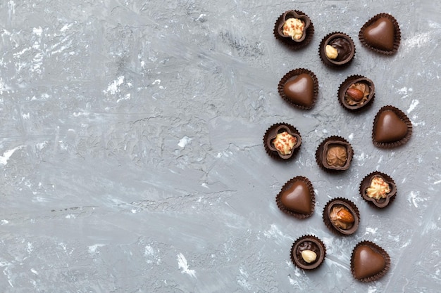 Different kinds of chocolates on colored table closeup Top View and Flat Lay with copy space