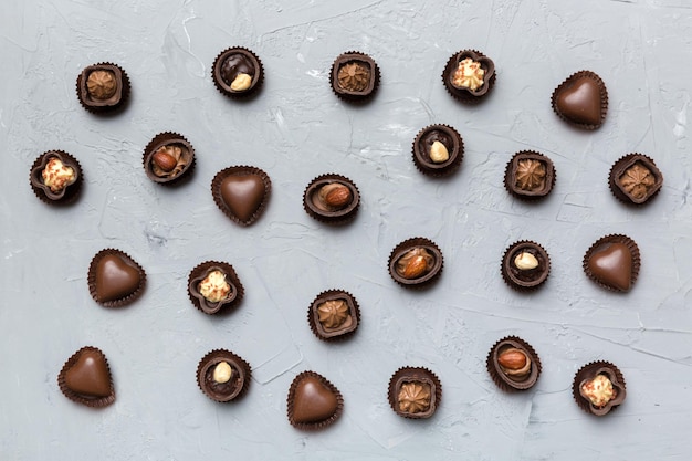 Different kinds of chocolates on colored table closeup Top View and Flat Lay