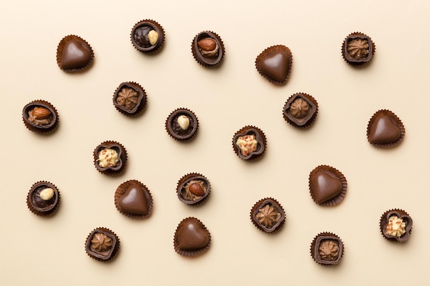 Different kinds of chocolates on colored table closeup Top View and Flat Lay