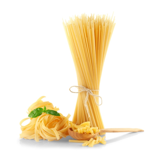 Different kinds of dry pasta, on white