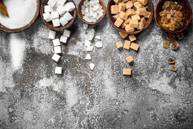 Different kinds of sugar in bowls.