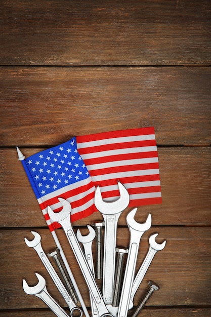 Different kinds of wrenches on a wooden background Labor day concept