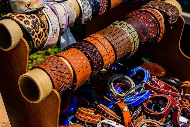 Different leather wristbands for sale on a street fair