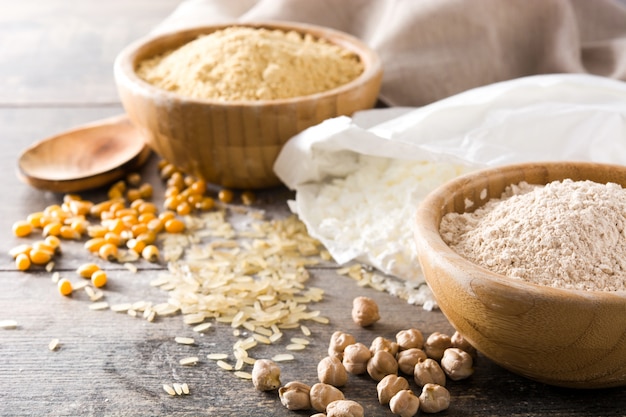 Different organic flour on wooden table