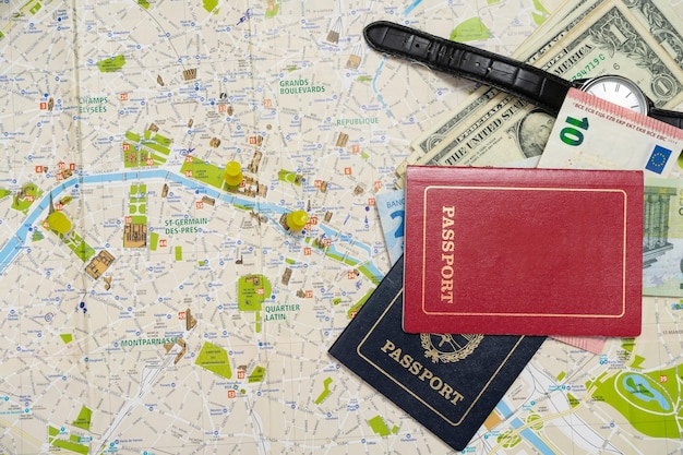 Different passports and different money on a map planning a vacation Vacation concept travel Copy space