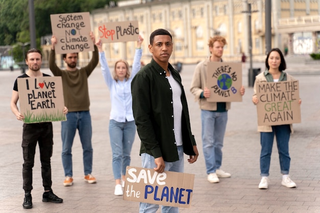 Photo different people marching in climate change protest