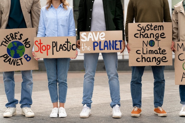 Photo different people marching in climate change protest