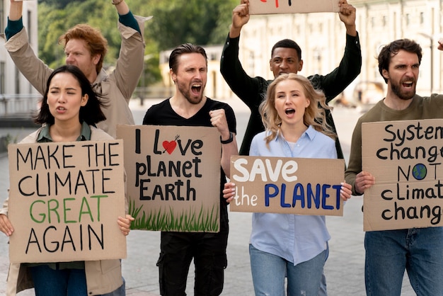 Photo different people marching in climate change protest