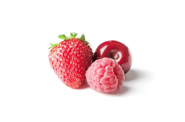 Different ripe tasty berries on white background such as strawberries cherries raspberries blueberries currants blueberries