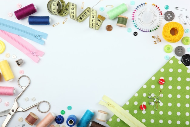 Different sewing accessories on the table closeup