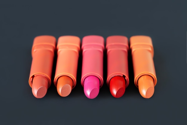 Photo different shades lipstick on background cosmetic product