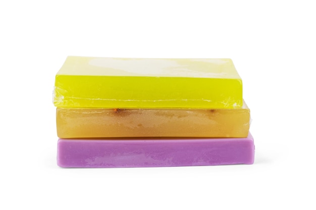 Different soaps in different soap dishes. A lot of solid soap for hygiene and cleanliness. Colorful soap and remnants are scattered