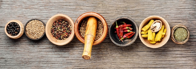 Different spices in bowls on table