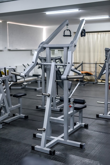 Different sport equipment in modern gym closeup