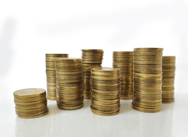 Different stacks of metal coins Israeli shekel selective focus