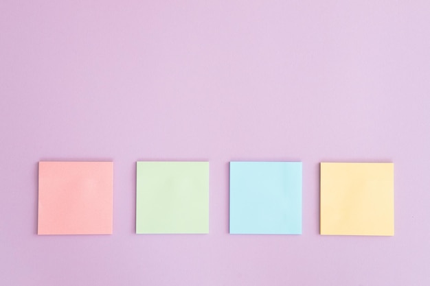 Different sticky notes on pink background