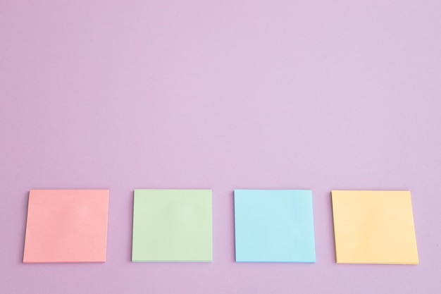 Different sticky notes on pink background