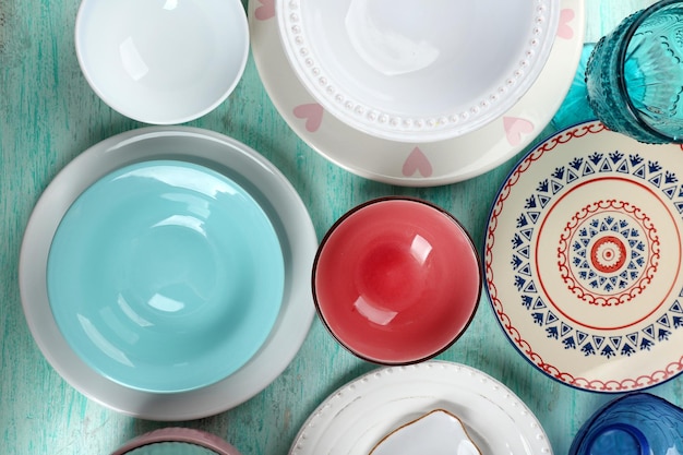 Different tableware on wooden table close up