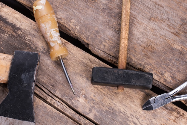 Different tools on old wooden background