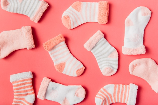 Different type of socks on bright backdrop