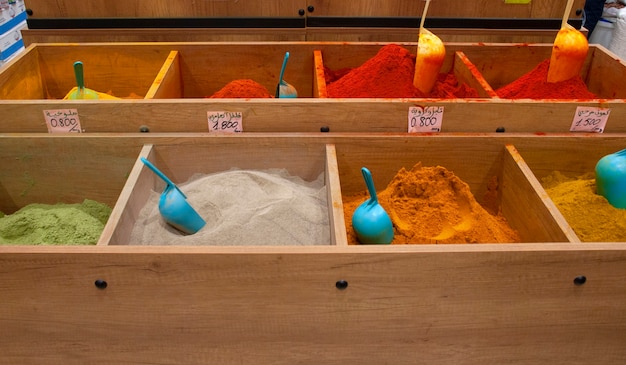 Different types of spices on the counter of the supermarket.