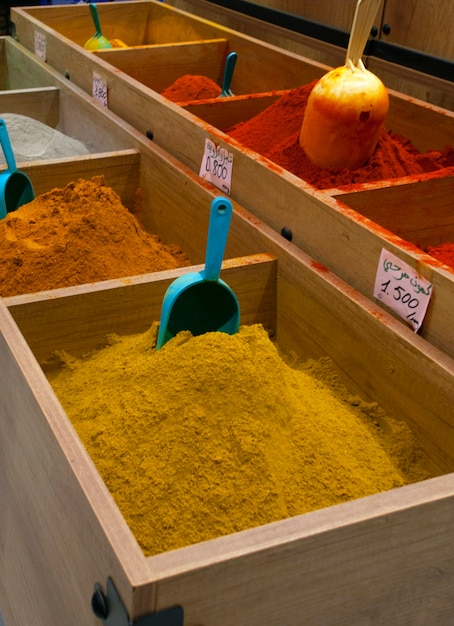 Different types of spices on the counter of the supermarket.