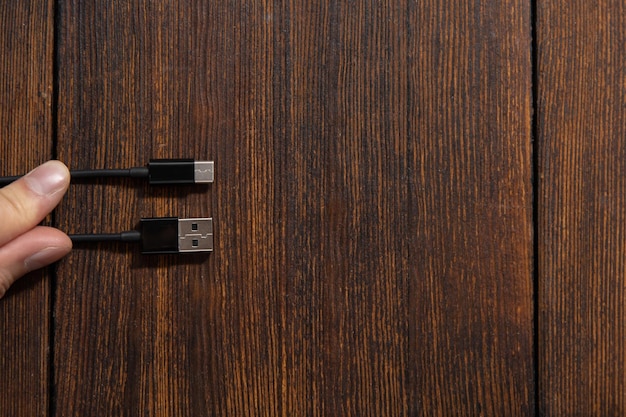 Different types of usb ports on a dark wooden background