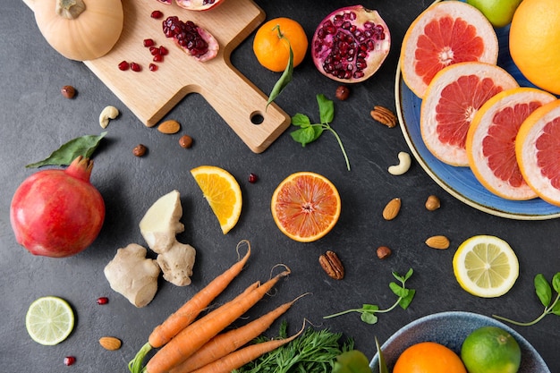 different vegetables and fruits on on slate table