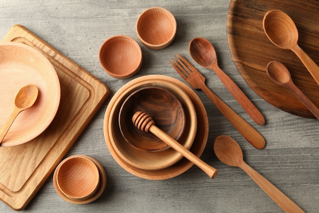 Different wooden dishes on gray table