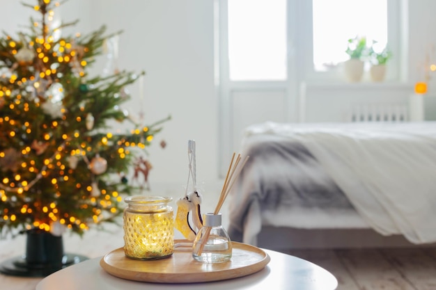 Diffuser and christmas decor in white bedroom