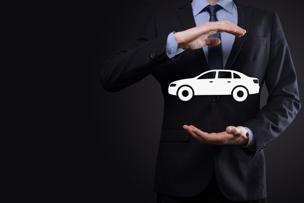 Photo digital composite of man holding car icon.car automobile insurance and car services concept. businessman with offering gesture and icon of car