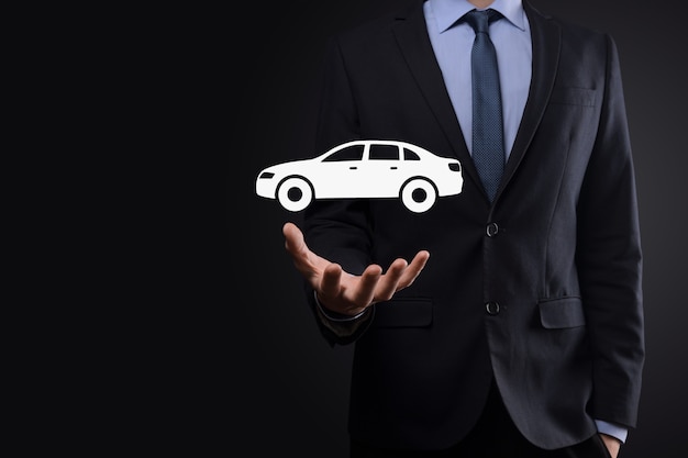 Photo digital composite of man holding car icon.car automobile insurance and car services concept. businessman with offering gesture and icon of car.