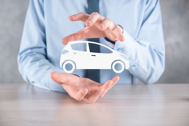 Digital composite of Man holding car icon.Car automobile insurance and car services concept. Businessman with offering gesture and icon of car.