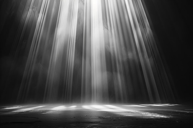 Digital image of black background with white light rays shining down creating an ethereal and mysti