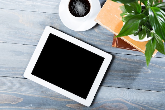 Digital tablet computer with isolated screen in male hands over cafe background - table,