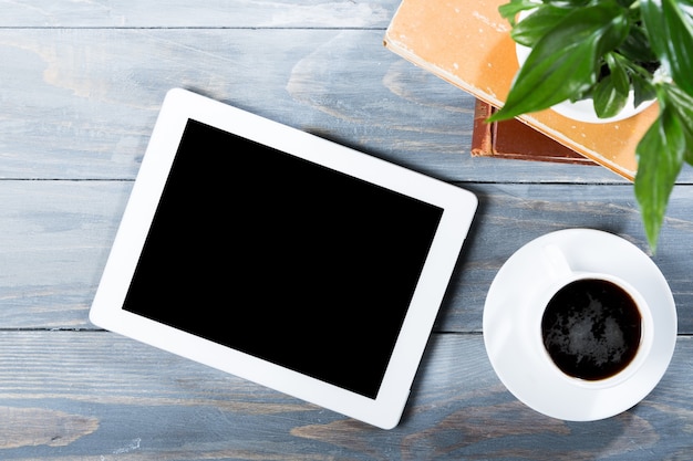 Digital tablet computer with isolated screen in male hands over cafe background - table,