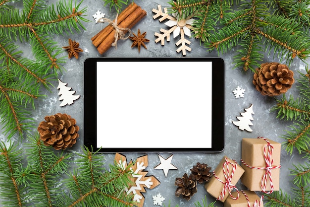 Digital tablet mock up with rustic Christmas decorations 