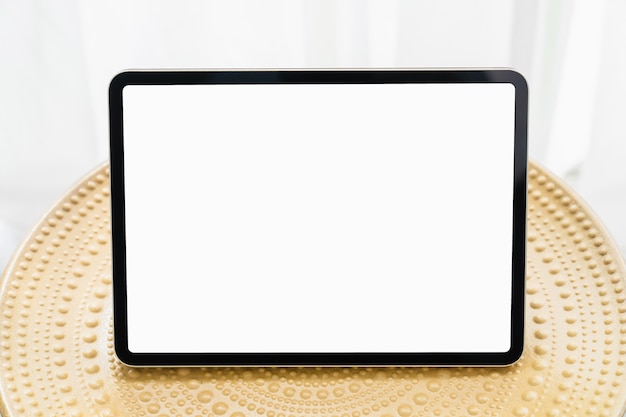 Digital tablet on the table and the screen is blank, copy space