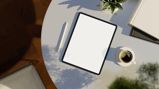 Digital tablet white screen mockup on modern white table top view workspace