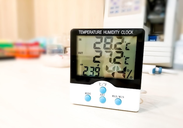 Digital temperature and humidity clock isolated for monitoring laboratory environment.